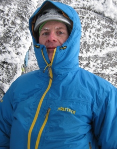 The author reaping the benefits of a decent belay parka, about to begin a frigid belay stint in the Cairngorms, Scotland.