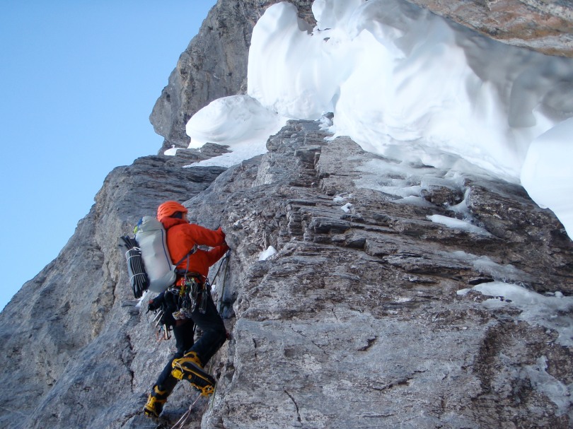 Arc'teryx Alpha Comp Hoody - great for technical climbing in cold, dry conditions. Here seen in action about to tackle the snow mushroom on the Ice Bulge pitch of the 1938 Route, Eiger North Face, Switzerland.